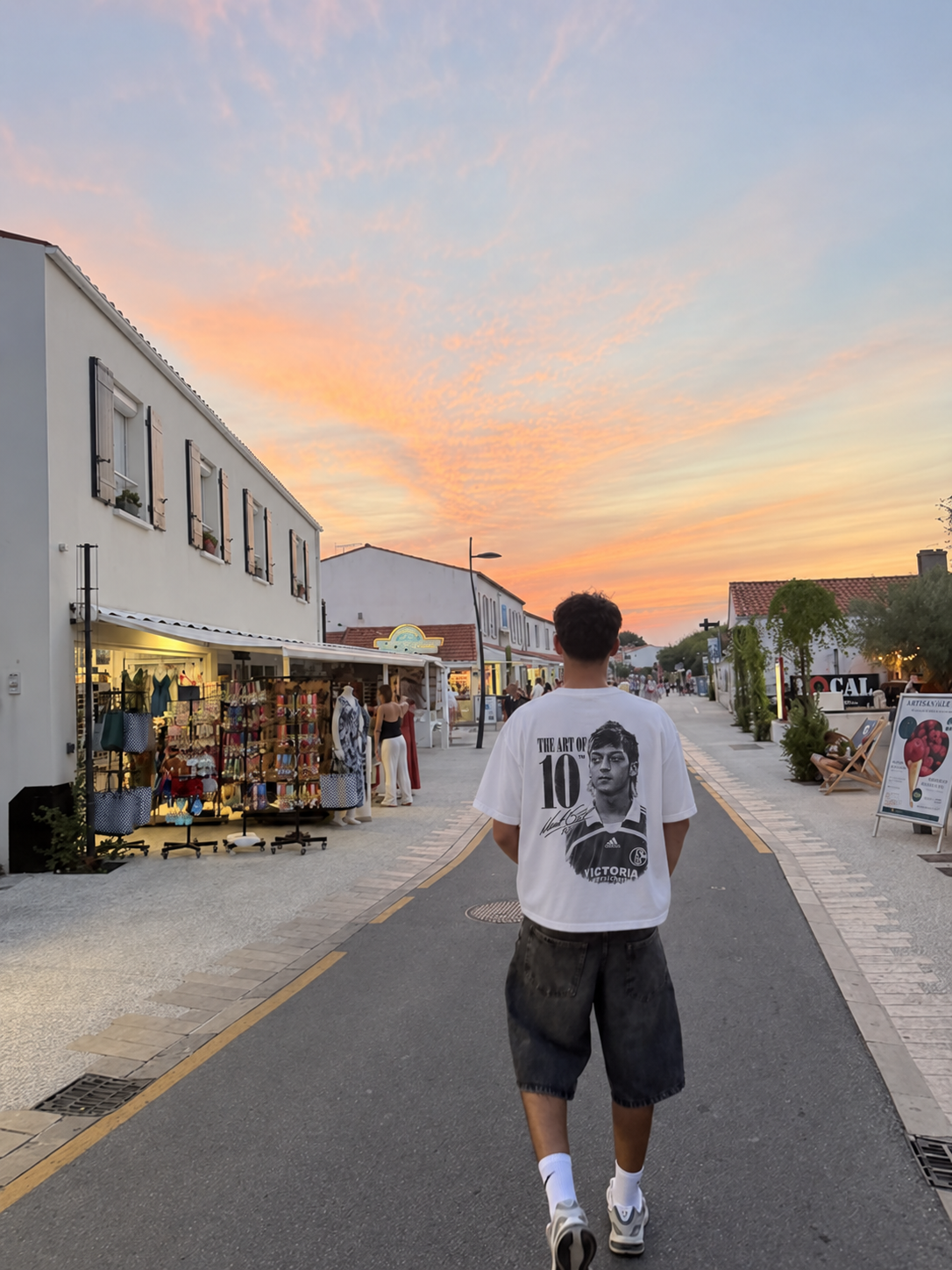 Model wearing the Day At The Office tee in the dunes at dusk