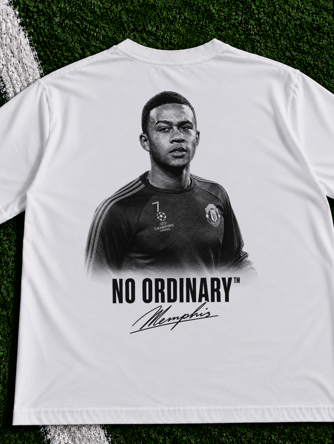 Memphis Depay No Ordinary organic heavy graphic T-shirt on football pitch zoomed in
