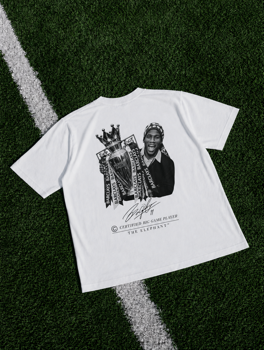 White heavyweight organic cotton T-shirt featuring a Didier Drogba-inspired football graphic with trophy artwork