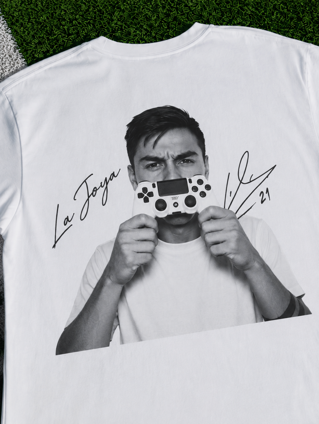 White La Joya 21 T-shirt with black-and-white Dybala portrait and gaming controller zoomed in