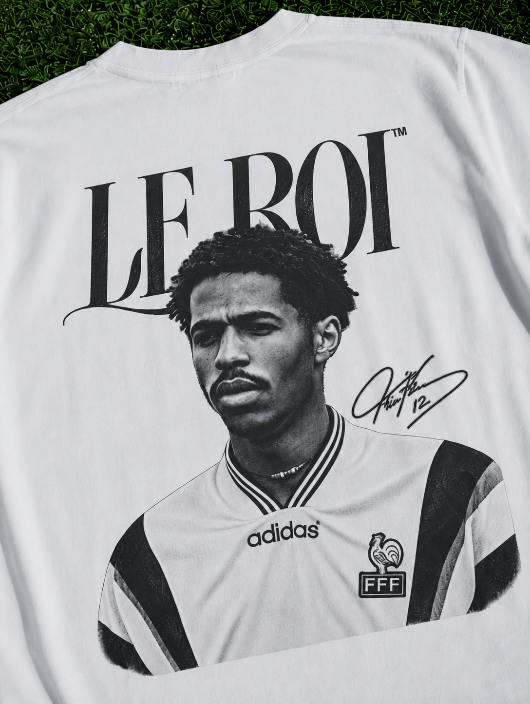 White heavyweight organic cotton T-shirt featuring a Thierry Henry-inspired LE ROI graphic zoomed in