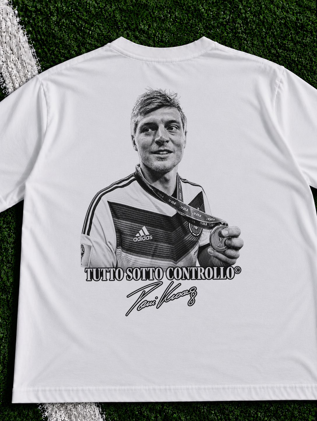 Toni Kroos Tutto Sotto Controllo organic heavy graphic T-shirt on football pitch zoomed in
