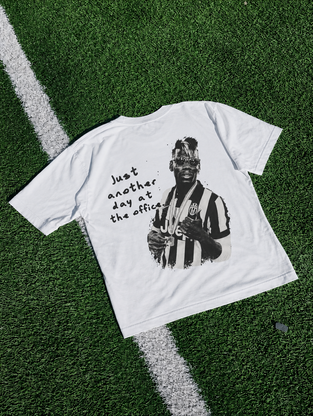 Back of the tee with Pogba print and the words Just another day at the office