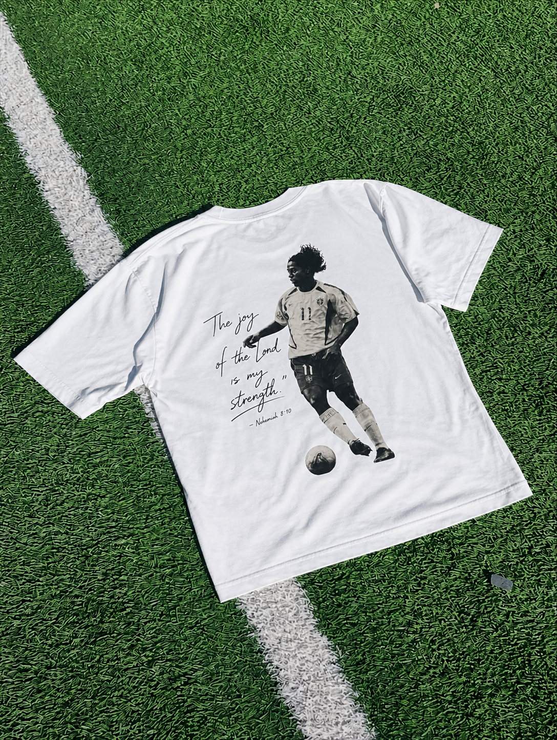 Back of the tee with Ronaldinho print and the verse The joy of the Lord is my strength