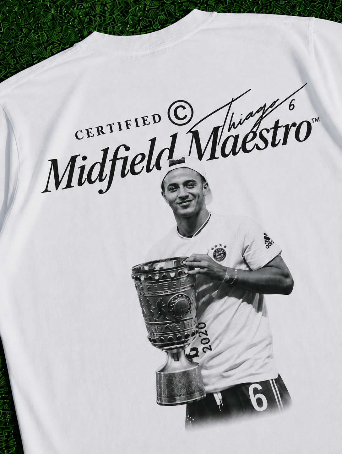 Thiago Midfield Maestro organic heavy white football T-shirt on a football pitch zoomed in