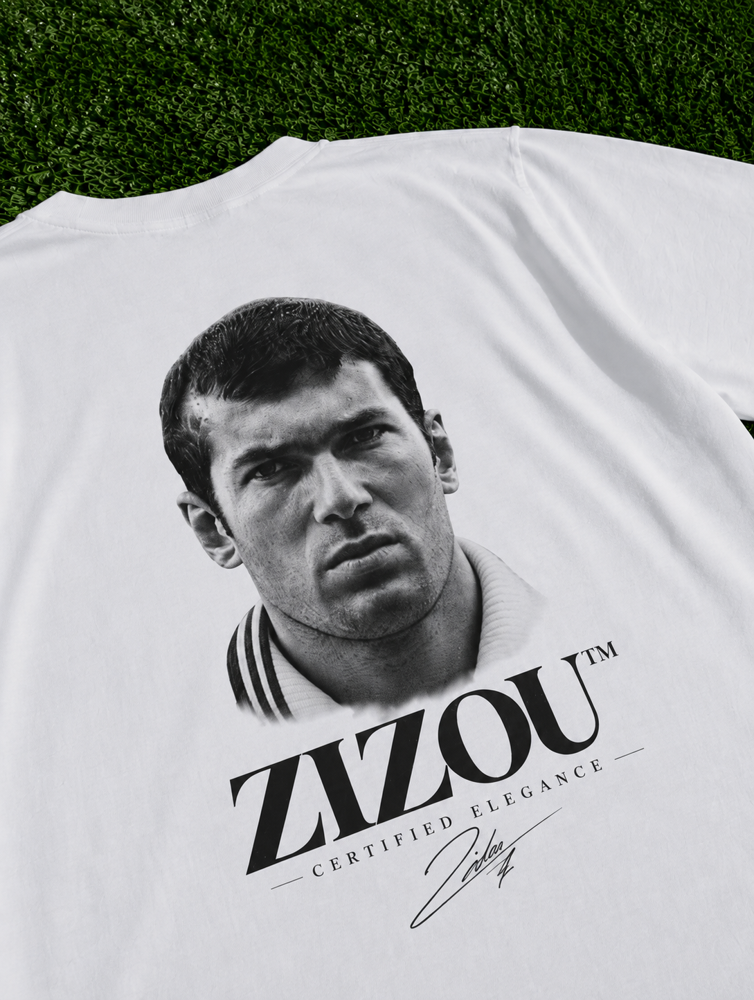 Zinedine Zidane Zizou Certified Elegance organic heavy white football T-shirt on a football pitch zoomed in